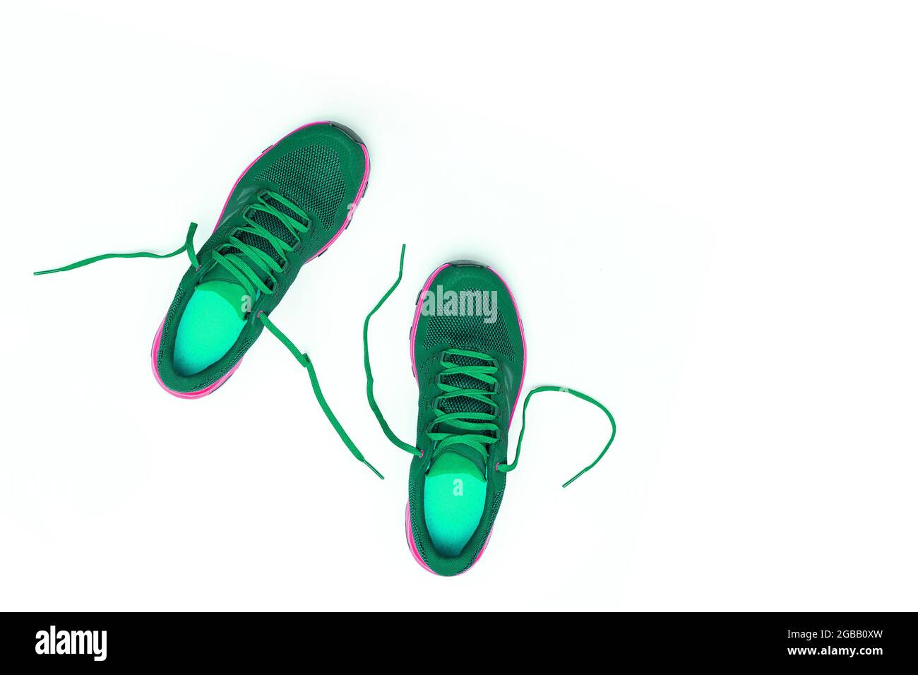 green sneakers on a white isolated background Stock Photo