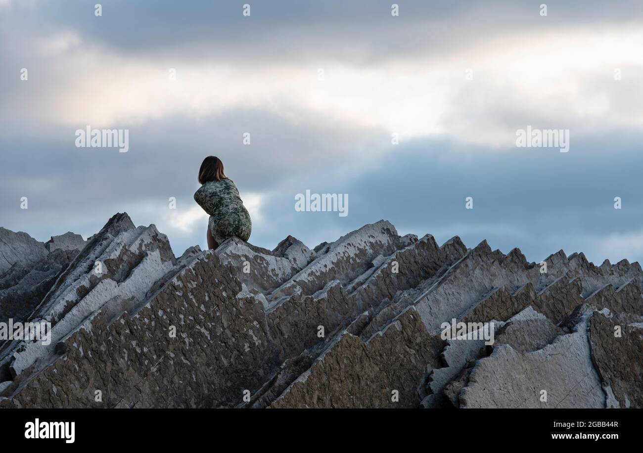 Girl Looking Over Rocks Lovely rocks formation hi-res stock photography and images - Alamy