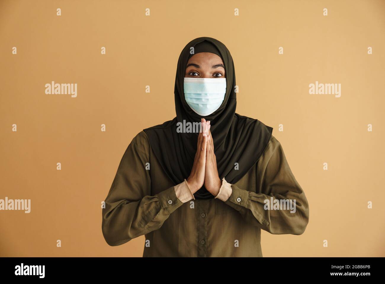 Muslim woman with face mask hi-res stock photography and images - Alamy