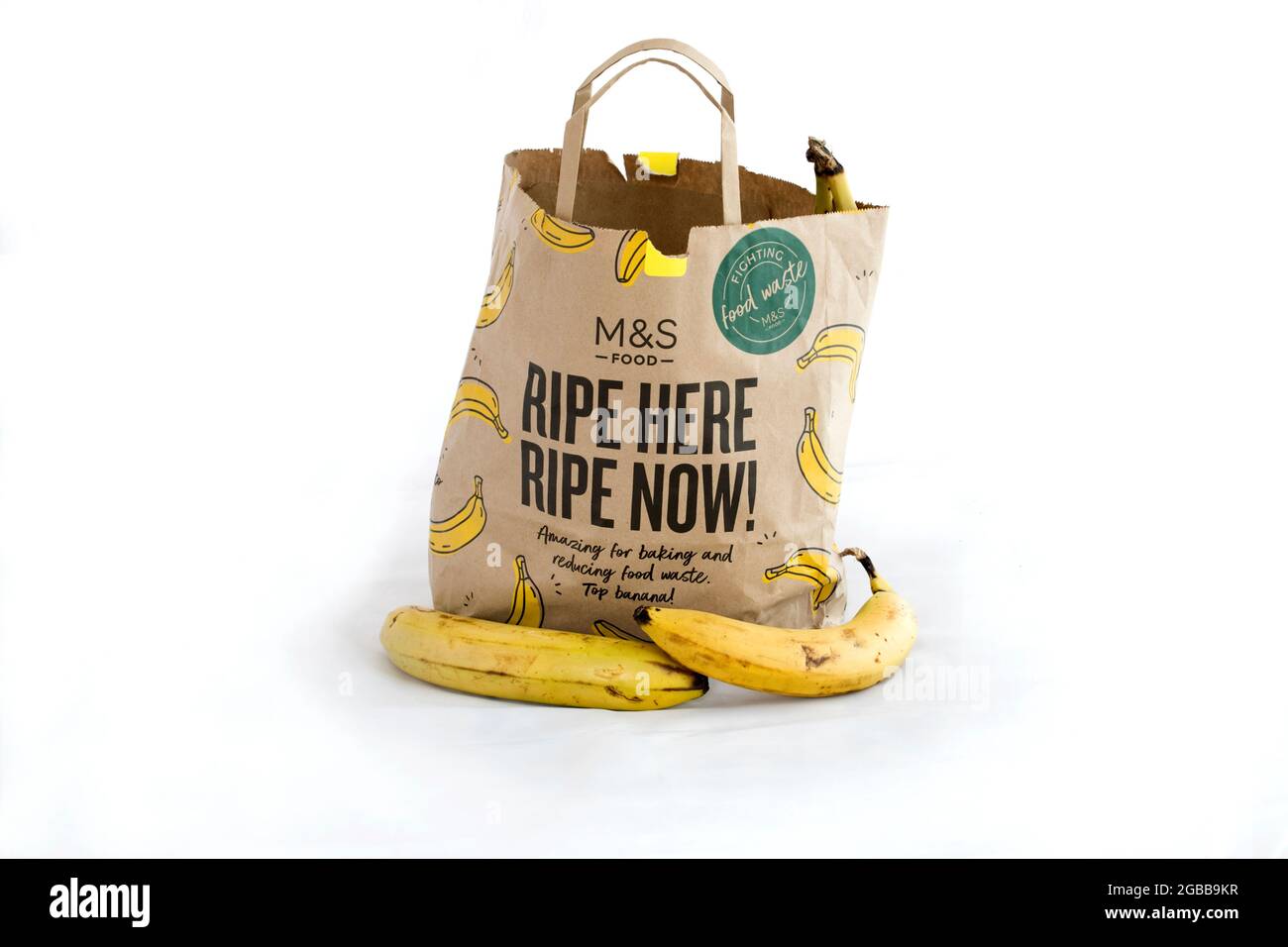 Marks and Spencer cutting food waste by selling extra ripe bananas at low prices in paper bags complete with appropriate recipes printed on the back.U Stock Photo