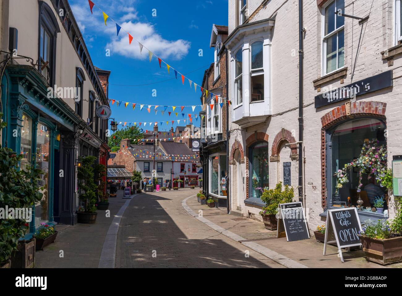 View of shops and cafes on Kirkgate, Ripon, North Yorkshire, England, United Kingdom, Europe Stock Photo