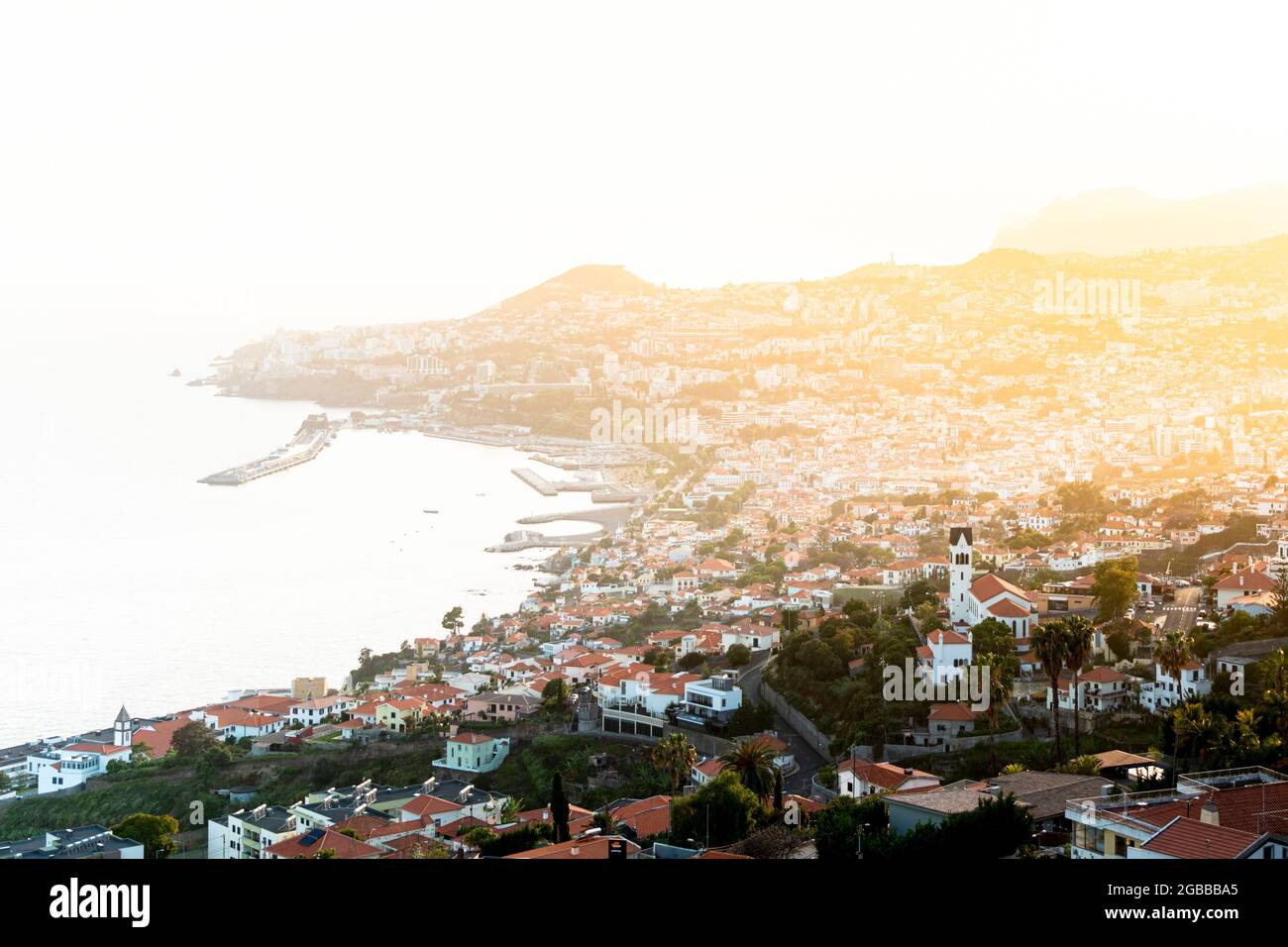 Mist at sunset over Funchal Bay and city viewed from Sao Goncalo, Madeira island, Portugal, Atlantic, Europe Stock Photo