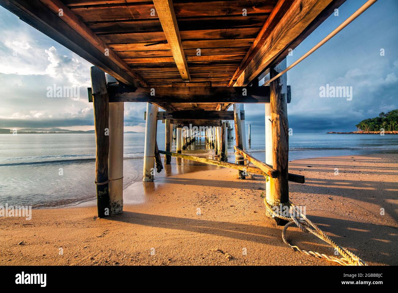 a view of a pier next to a body of water Stock Photo - Alamy