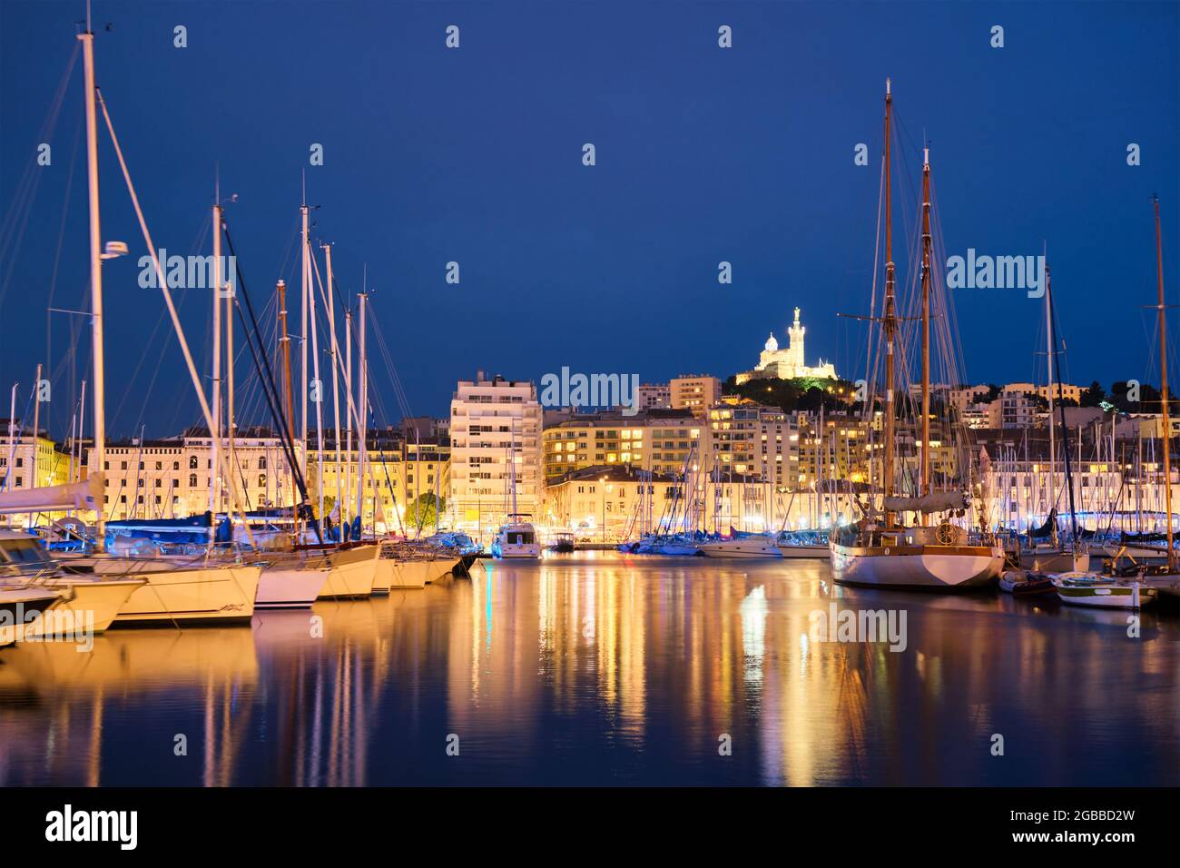 Vieux port and notre dame de la garde by night hi-res stock photography ...