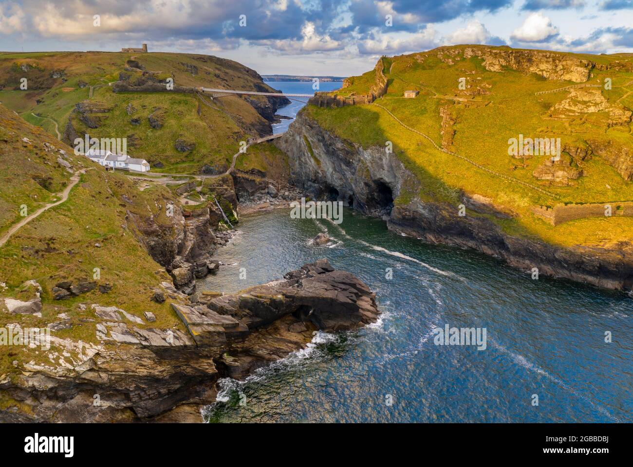 Aerial view of Tintagel Castle and bridge at dawn in spring, Cornwall, England, United Kingdom, Europe Stock Photo