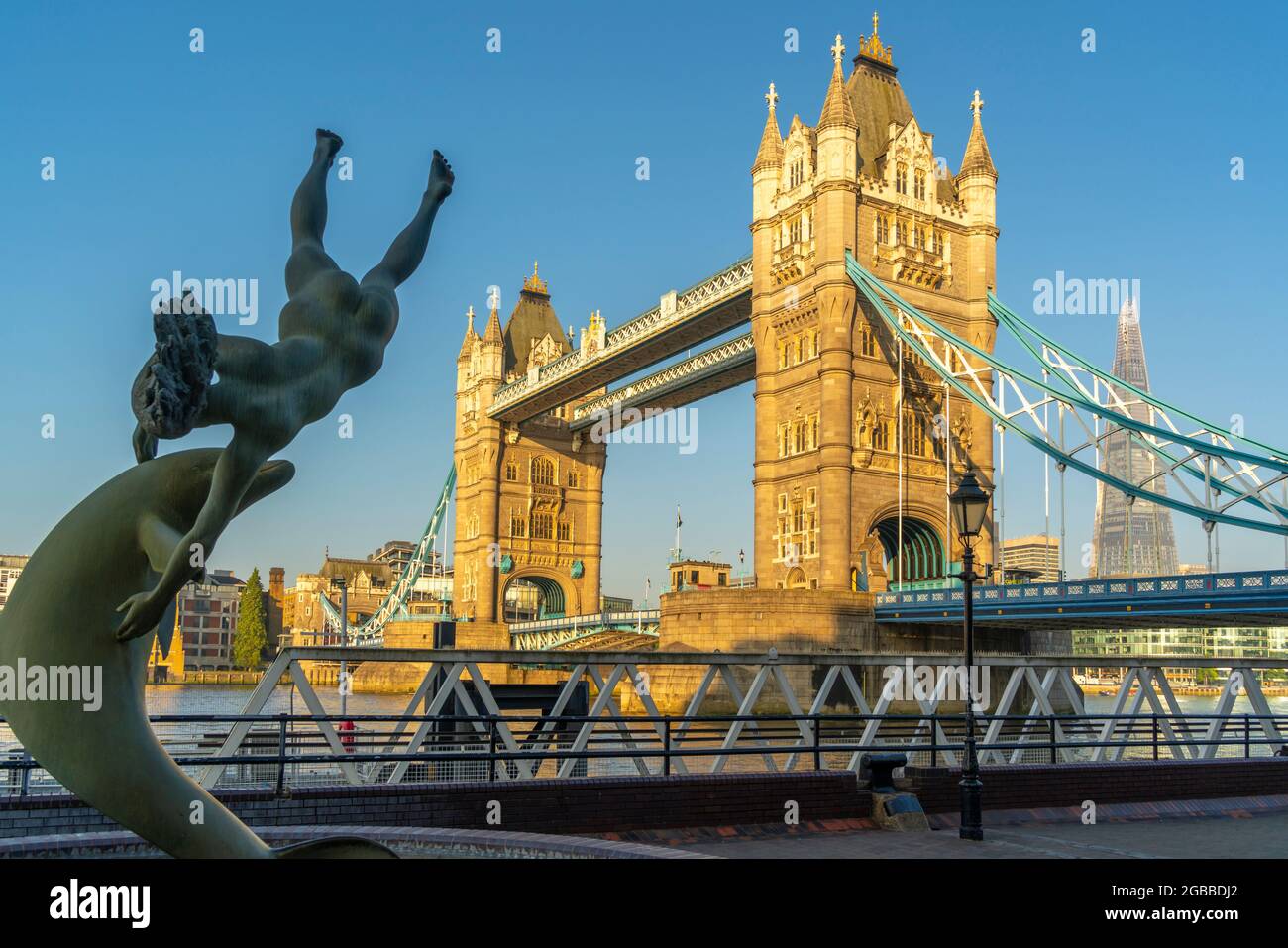 View of Tower Bridge and Girl with a Dolphin statue, London, England