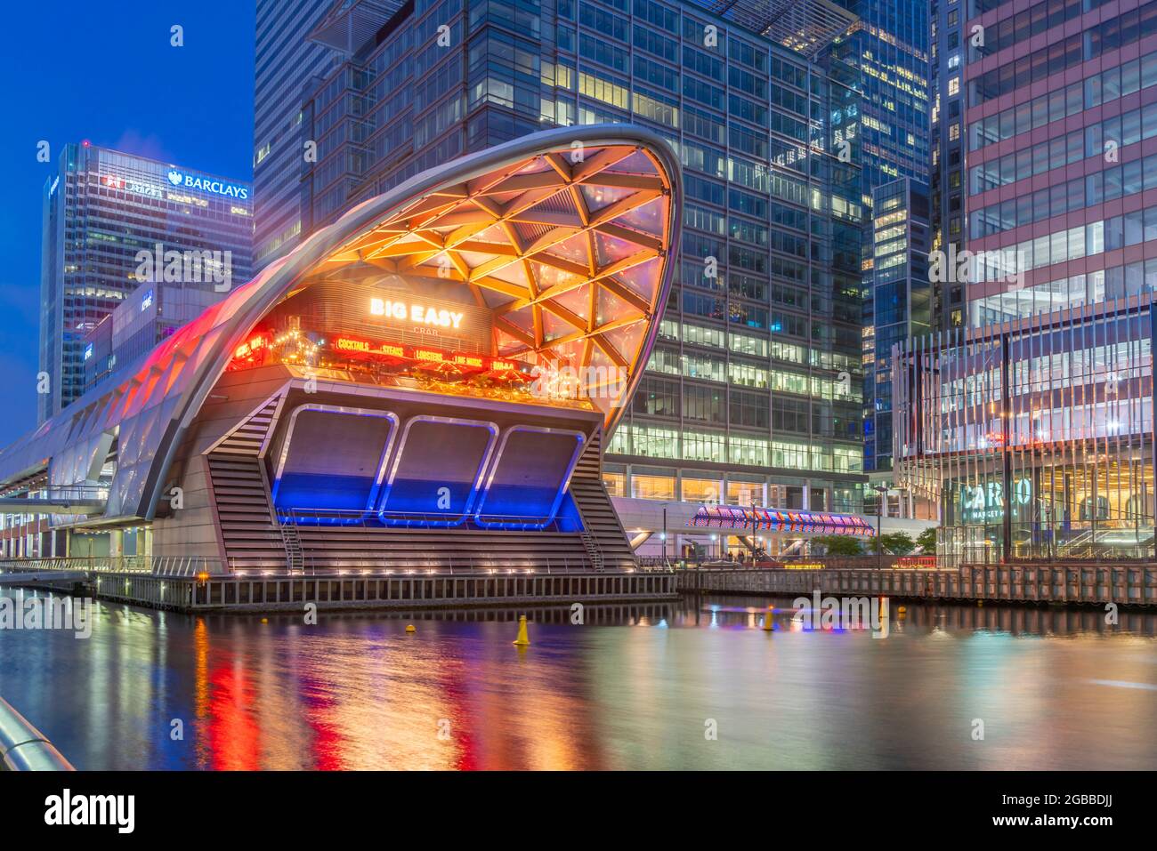 View of the Crossrail Station in Canary Wharf and tall buildings at dusk, Docklands, London, England, United Kingdom, Europe Stock Photo