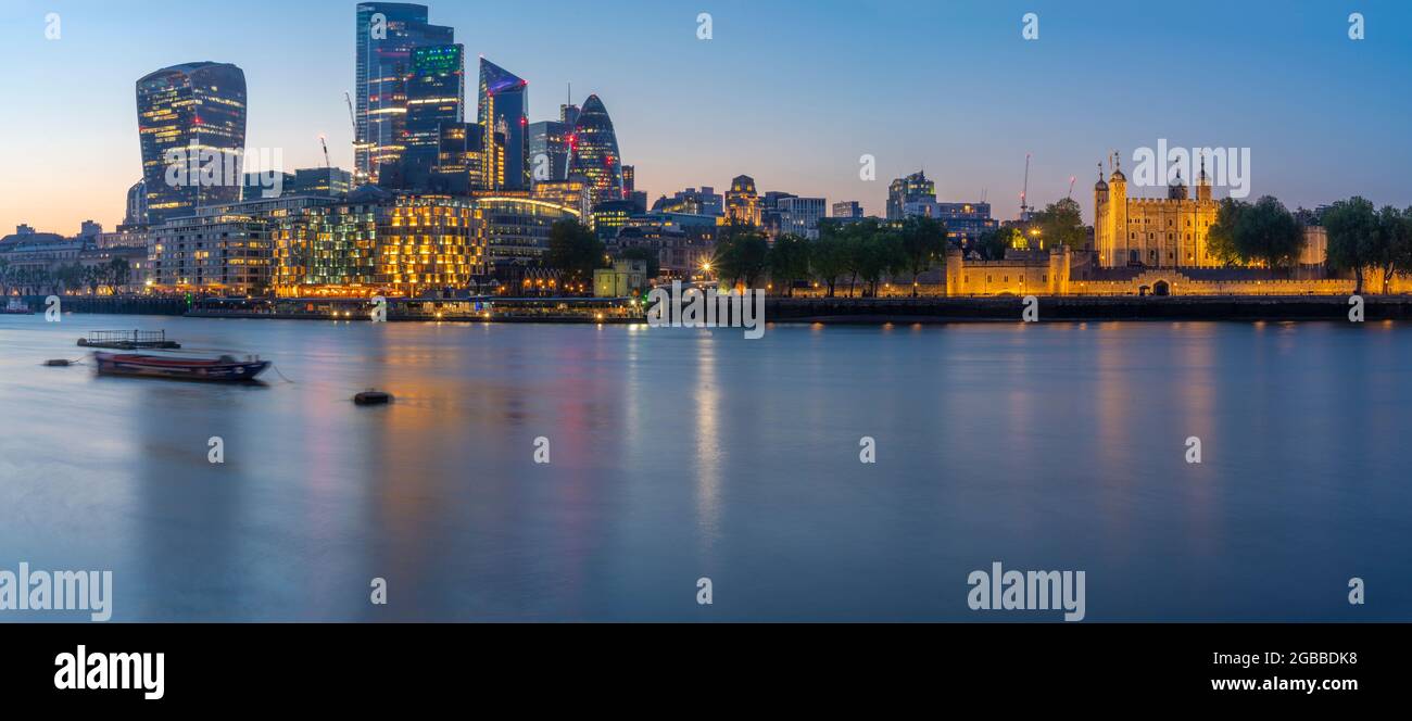 View of the Tower of London, River Thames and City of London at dusk, London, England, United Kingdom, Europe Stock Photo