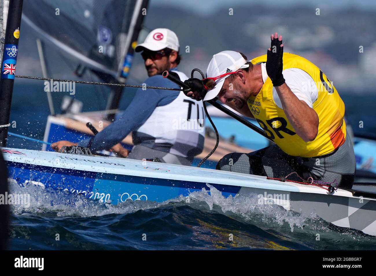 Great Britain's Giles Scott celebrates his Gold after the Men’s Finn medal race during the Sailing at Enoshima on the eleventh day of the Tokyo 2020 Olympic Games in Japan. Picture date: Tuesday August 3, 2021. Stock Photo