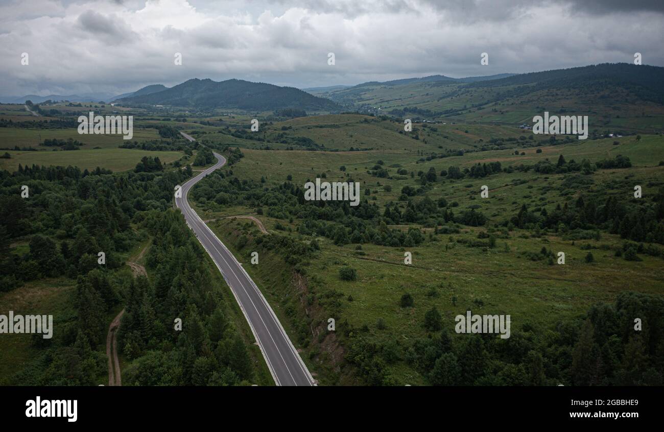 Aerial view on mountain road from drone Stock Photo - Alamy
