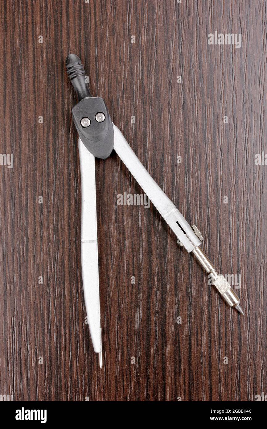 Drafting instrument on wooden background Stock Photo Alamy