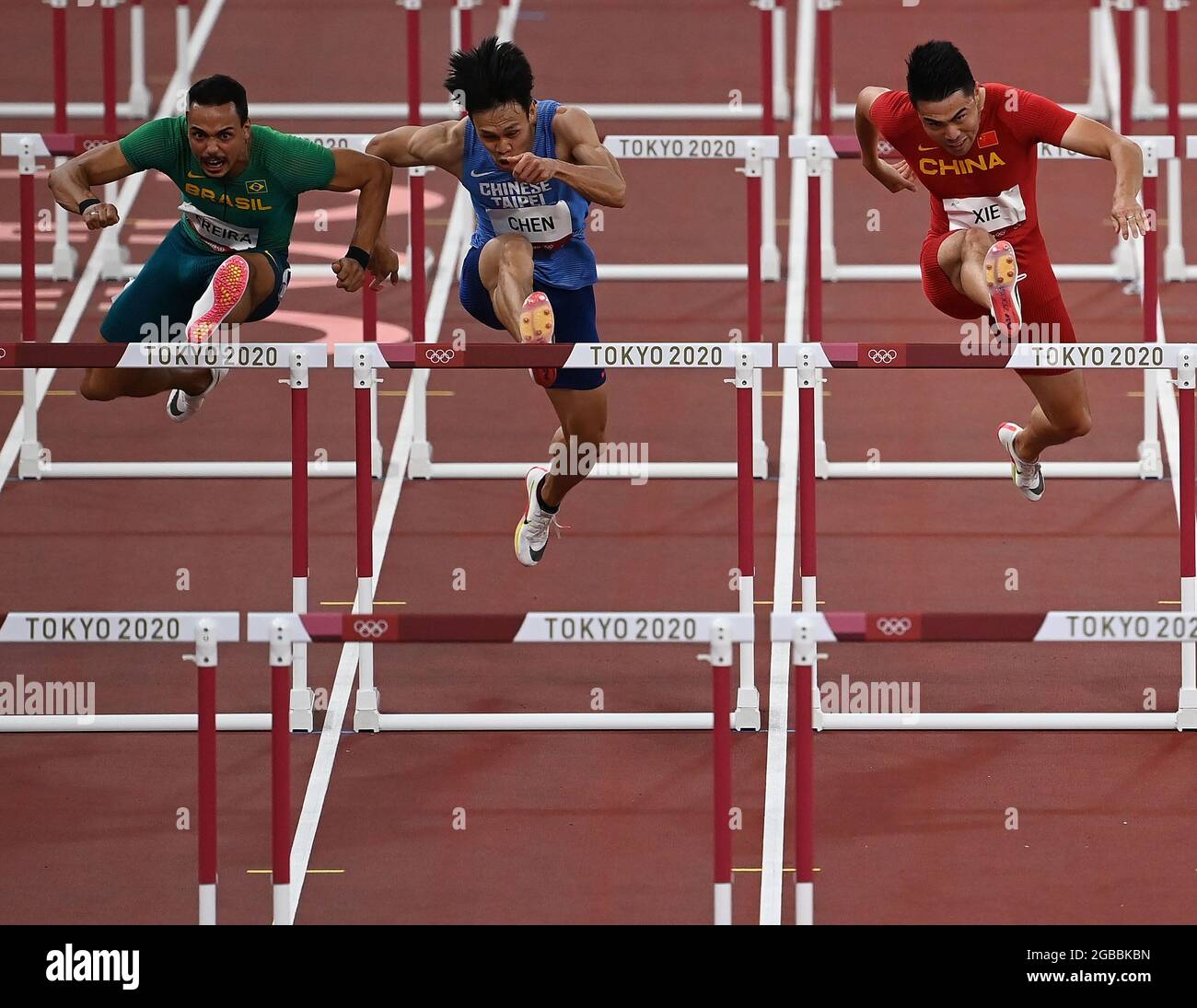 Tokyo, Japan. 3rd Aug, 2021. (from L to R)Rafael Pereira of Brazil, Chen Kuei-Ru of Chinese Taipei and Xie Wenjun of China compete during the Men's 110m Hurdles Heat at the Tokyo 2020 Olympic Games in Tokyo, Japan, Aug. 3, 2021. Credit: Li Yibo/Xinhua/Alamy Live News Stock Photo