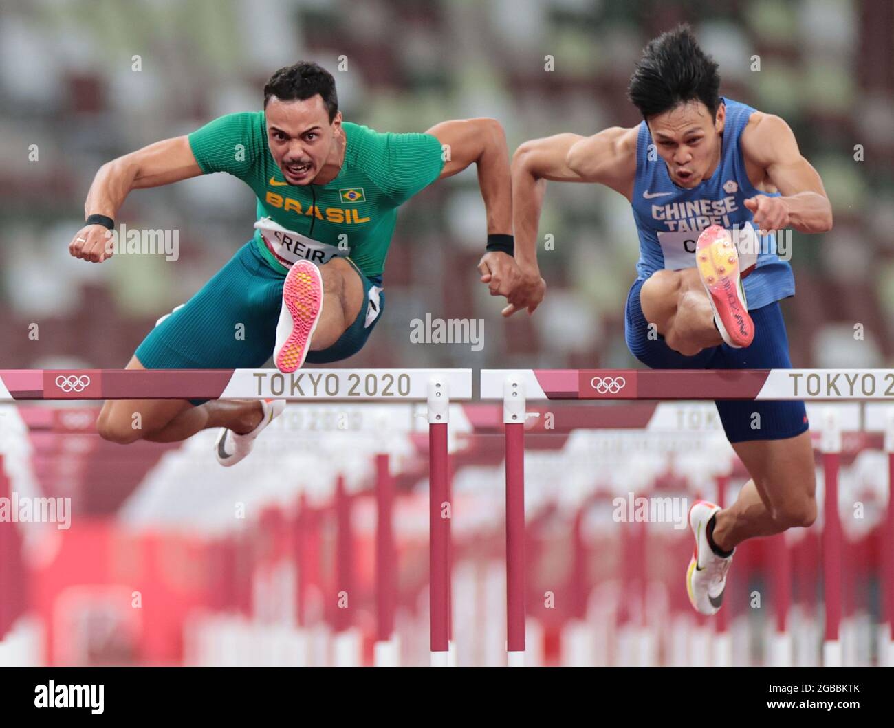Tokyo, Japan. 3rd Aug, 2021. Rafael Pereira (L) of Brazil and Chen Kuei-Ru of Chinese Taipei compete during the Men's 110m Hurdles Heat at the Tokyo 2020 Olympic Games in Tokyo, Japan, Aug. 3, 2021. Credit: Li Gang/Xinhua/Alamy Live News Stock Photo