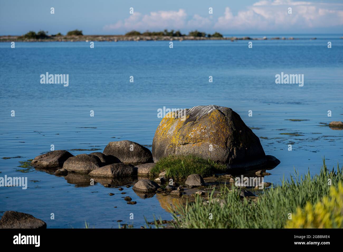 An ocean boulder in beautiful sunset light. Picture from the Baltic Sea island of Oland Stock Photo
