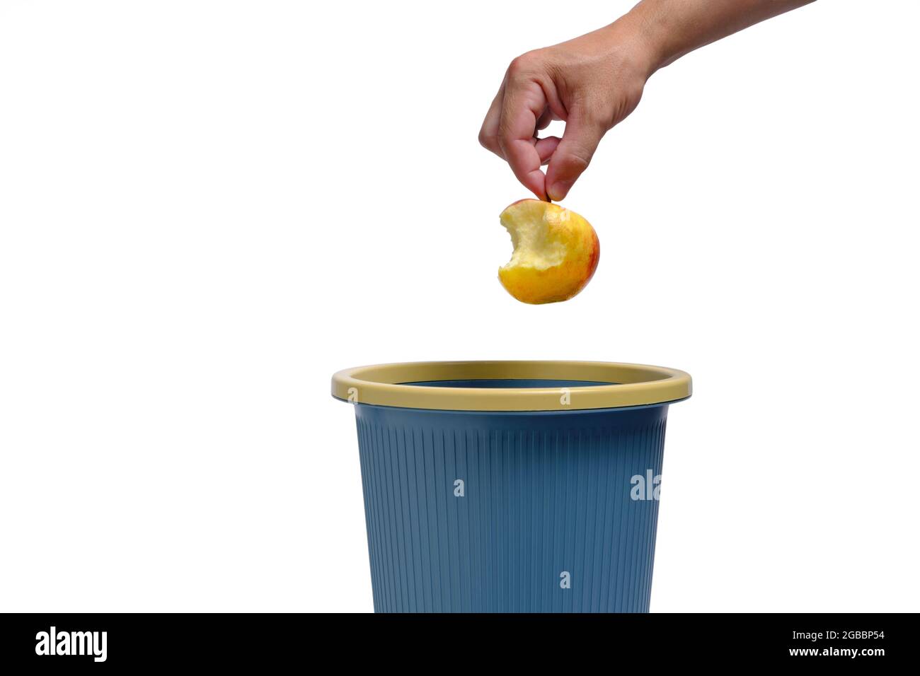 apple-core-is-thrown-into-trash-food-wasteon-white-background-isolate-2GBBP54.jpg