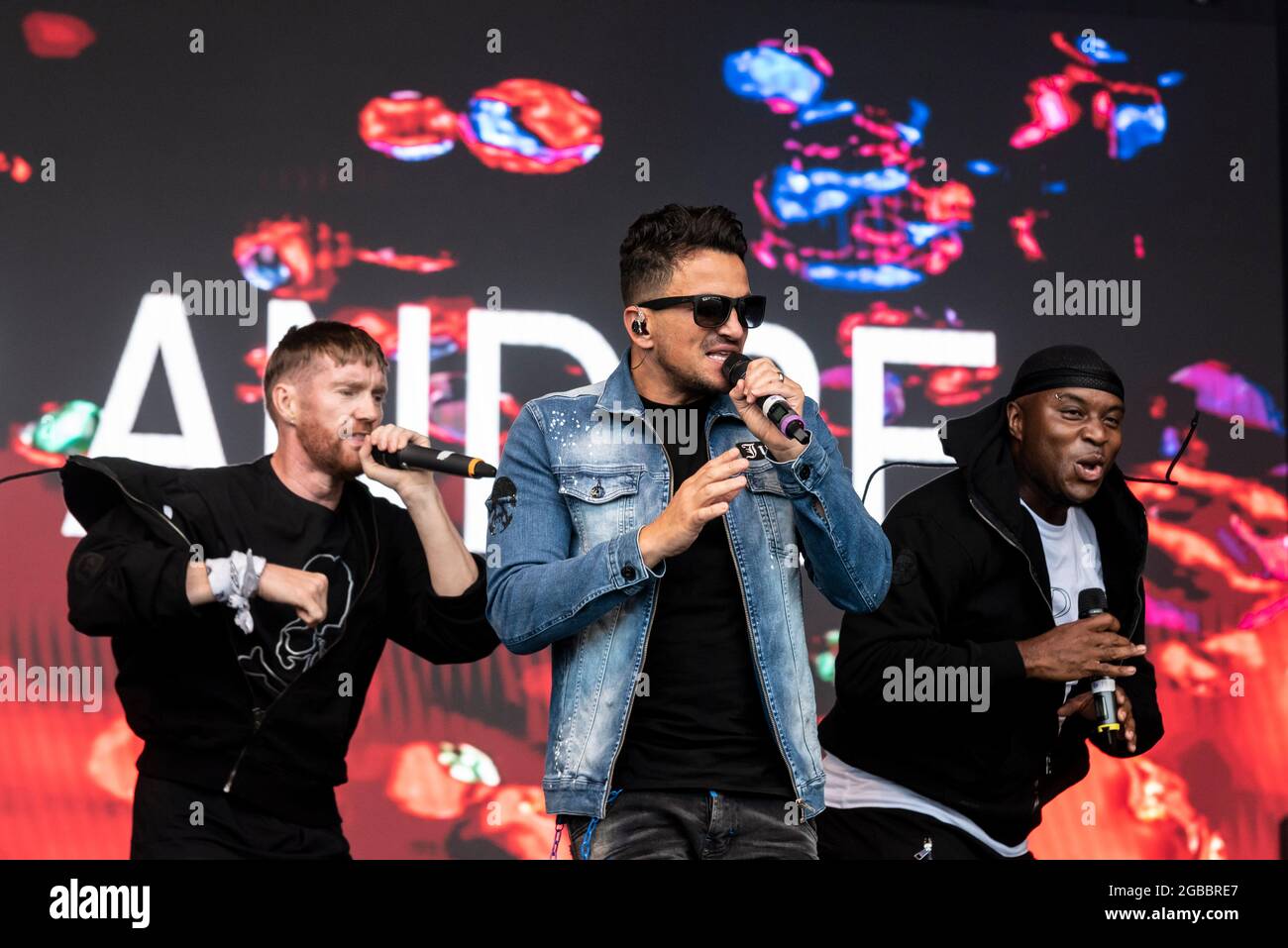 Peter Andre performing on stage with backing singers at the Fantasia music concert in Maldon, Essex, UK soon after lifting of COVID restrictions Stock Photo