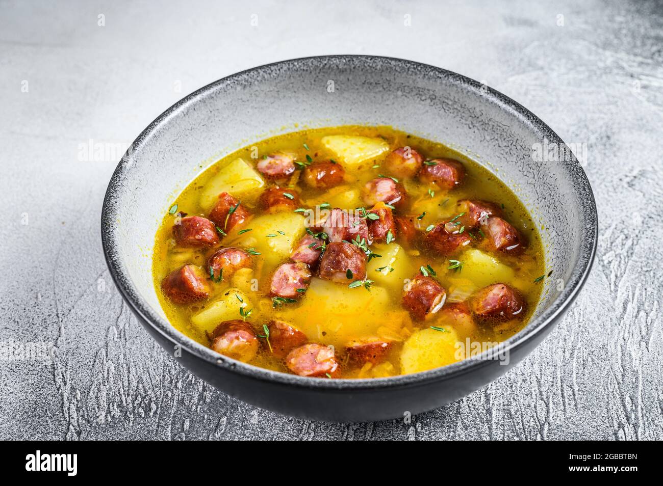 German Split pea soup with smoked sausages. White background. Top view Stock Photo