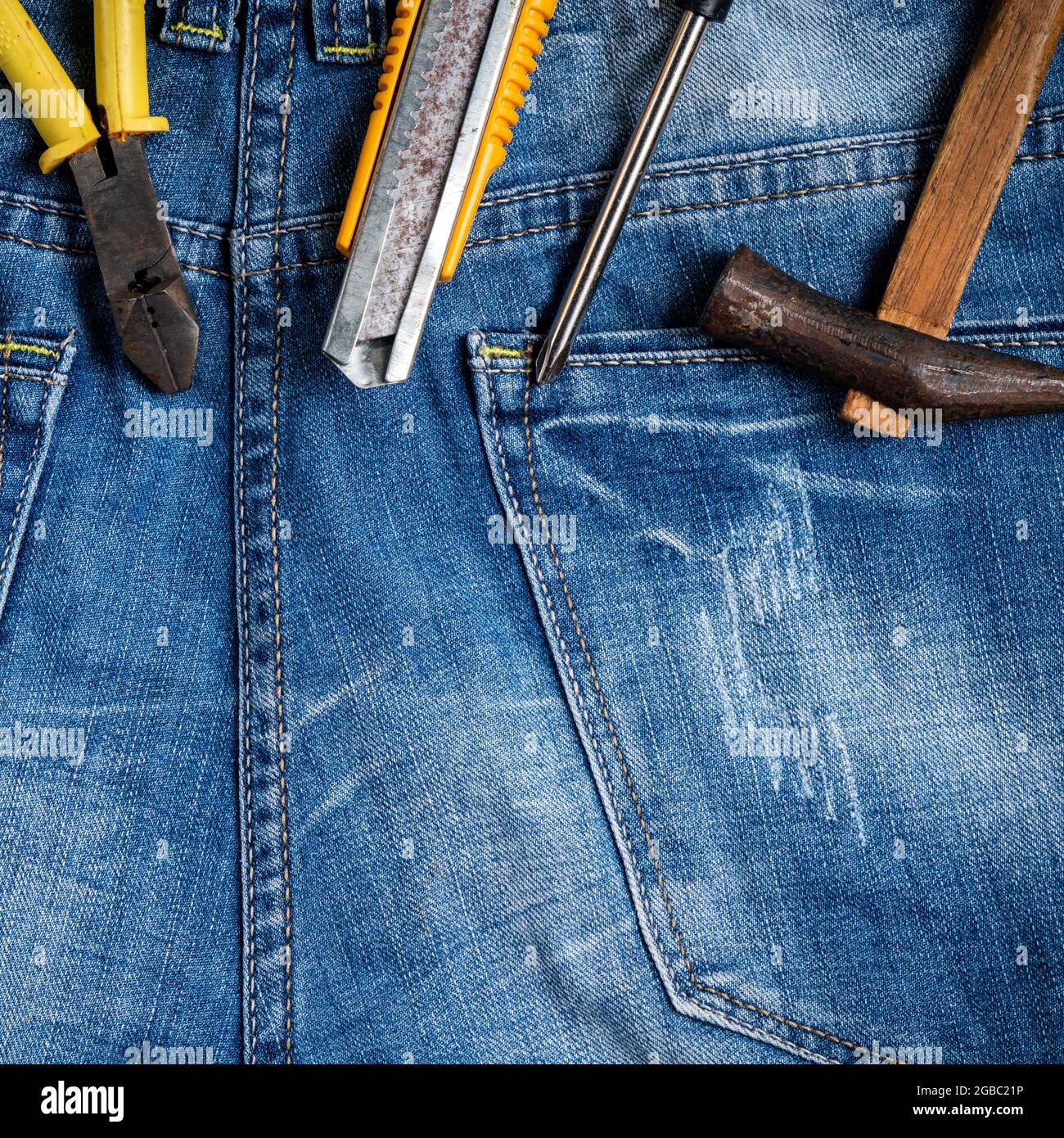 Top view design concept of Labor Day with working tools on blue jeans  background Stock Photo - Alamy