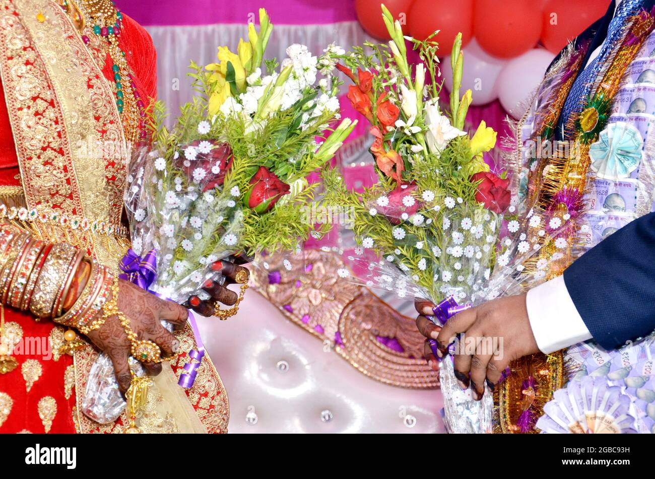 Indian Wedding Couple Holding Bouquet In Hand Stock Photo