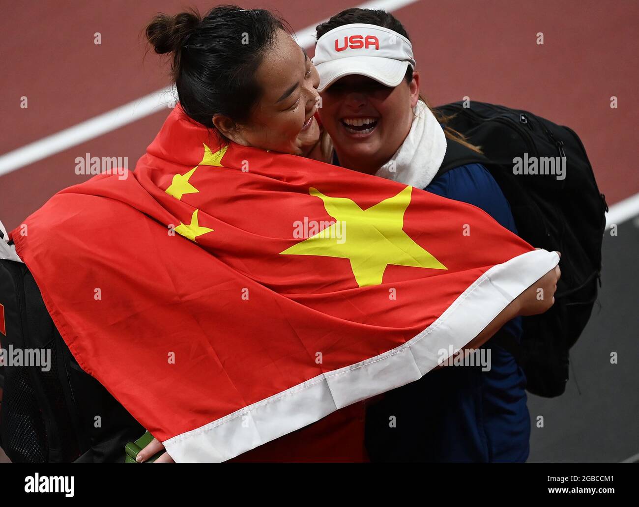 Tokyo, Japan. 3rd Aug, 2021. Wang Zheng (L) of China celebrates with