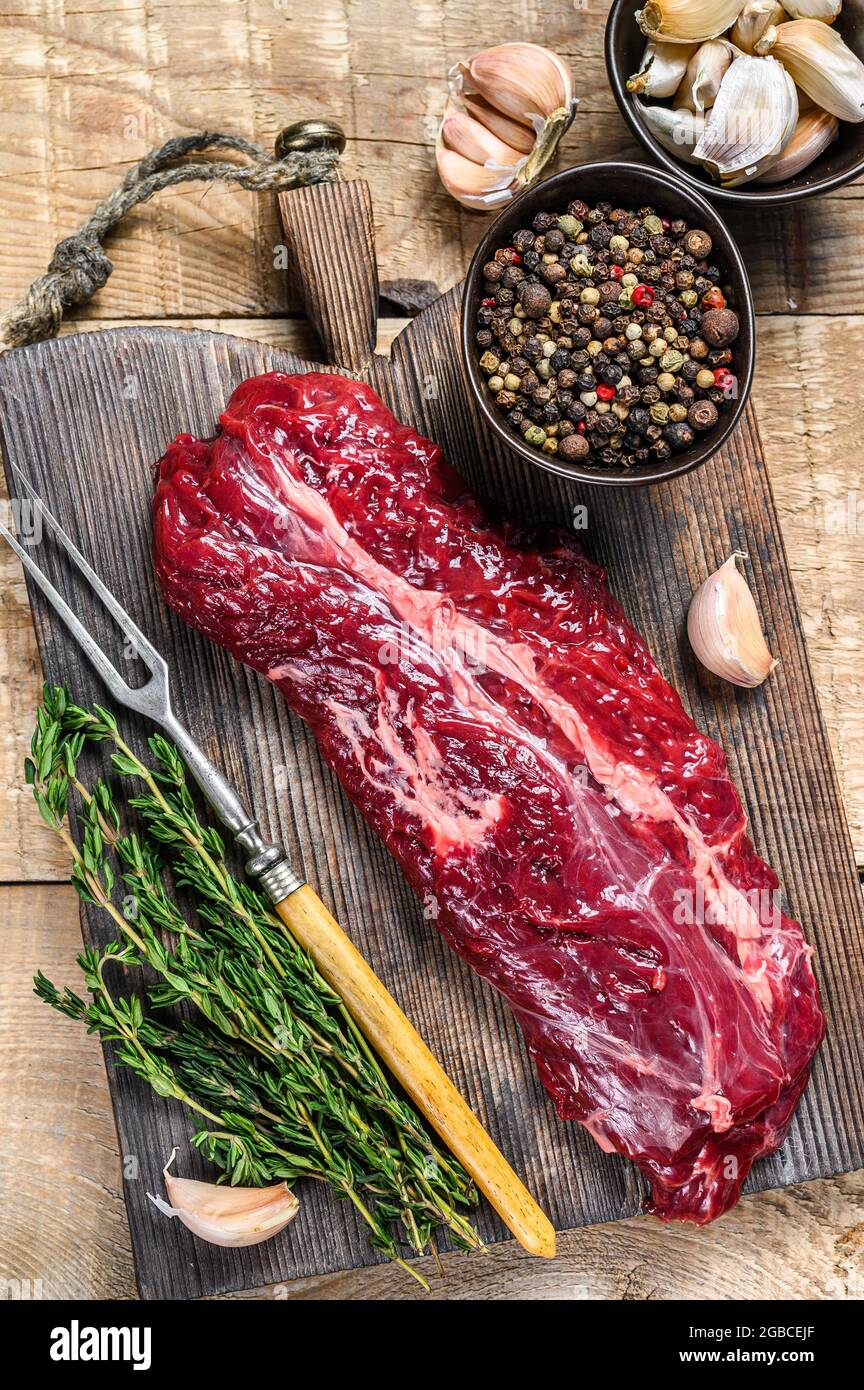 Butchers choice steak Onglet Hanging Tender beef meat. wooden background. Top view Stock Photo