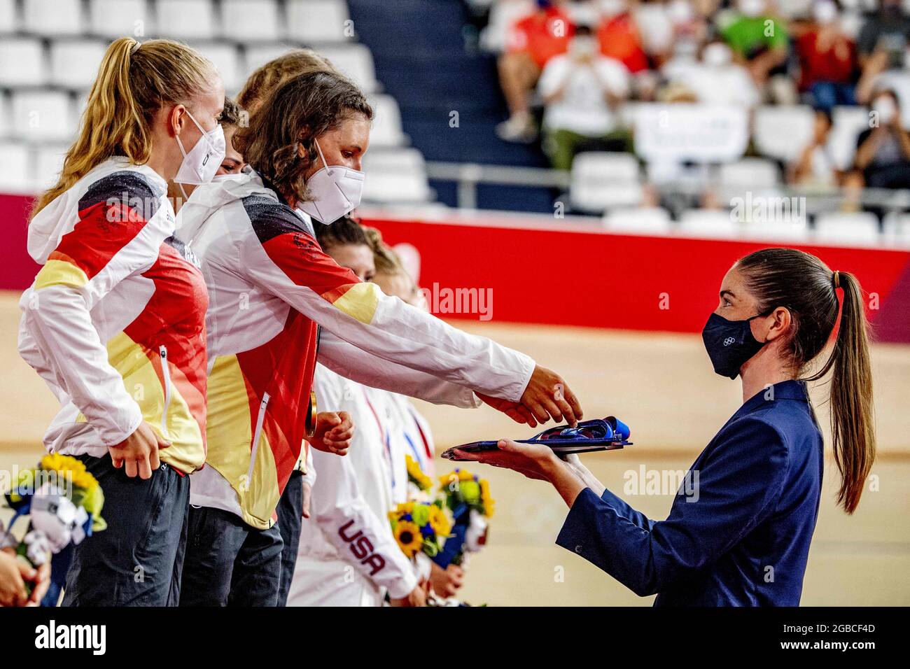 Gold medalists Charlotte Becker, Franziska Brausse, Lisa Brennauer and Lisa  Klein from German Team celebrates after winning the gold medal and setting  a new world record in the track cycling women's team