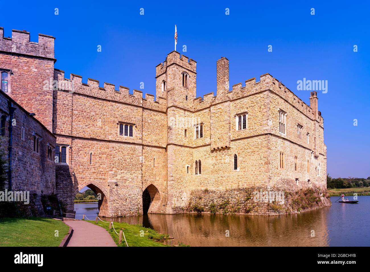 Rear façade and moat with punt at leeds castle kent england Stock Photo