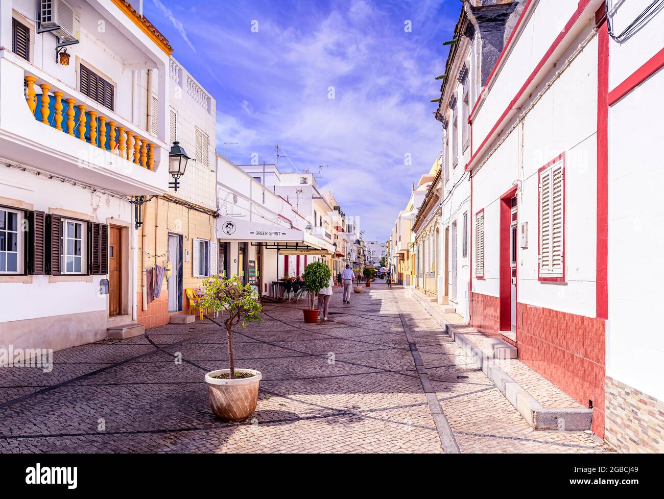 Typical portuguese cobble stone paved street , calcada portuguesa portuguese paving stones. Fuseta East Algarve Portugal Stock Photo