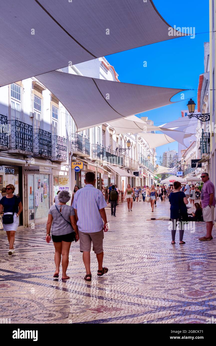 People in a Shopping street and district at the centre at Faro east algarve Stock Photo