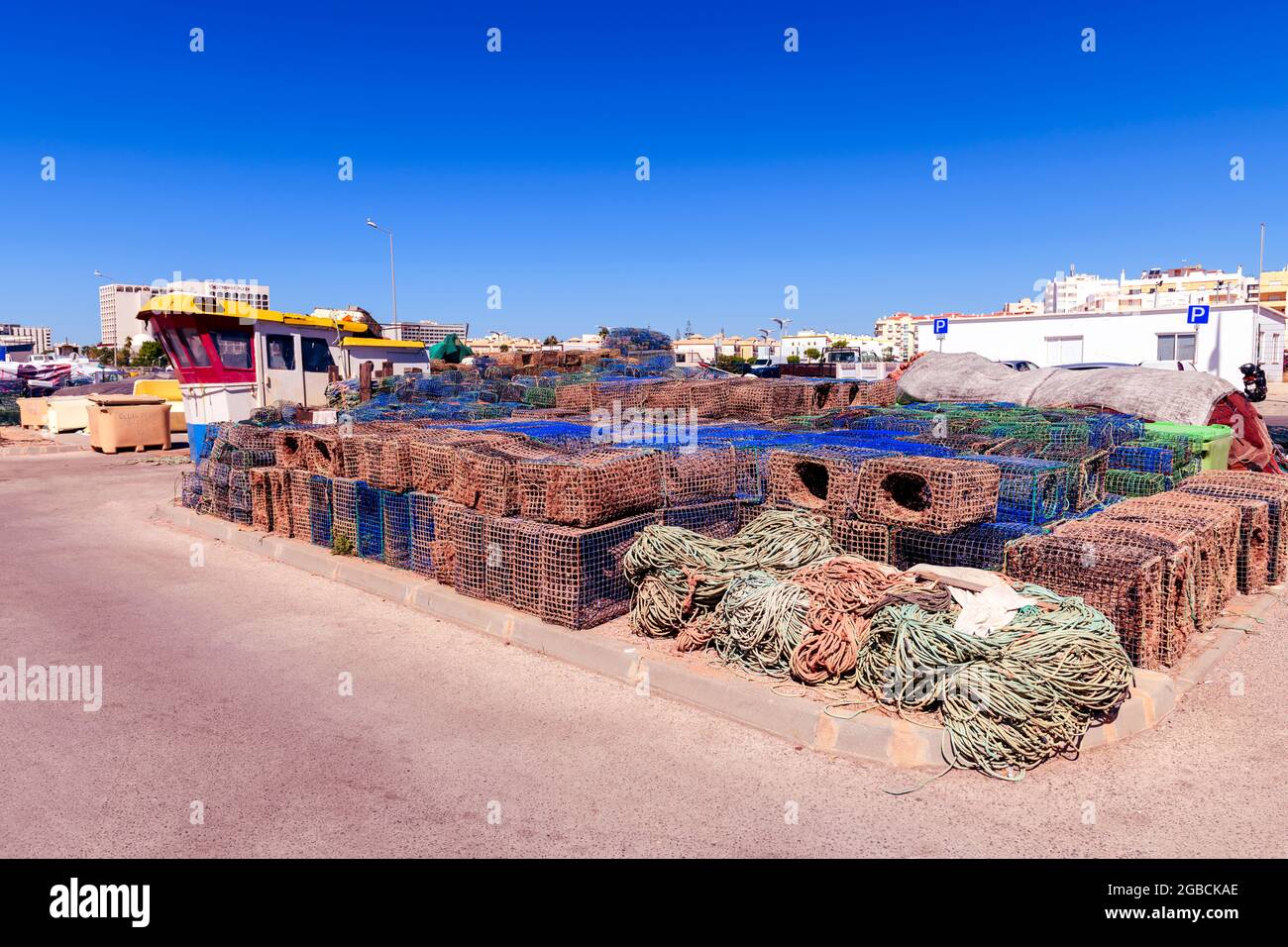Octopus nets traps Pots stacked on the quayside  Quarteira in the Algarve region of Portugal net pot trap Stock Photo