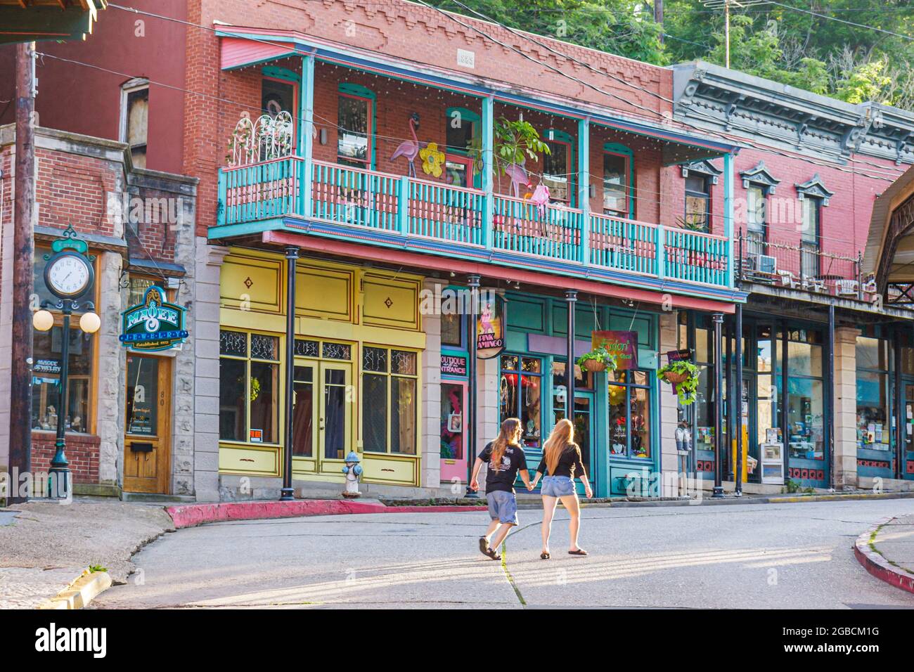 Arkansas Ozark Mountains Eureka Springs renovated historic shops businesses,couple walking