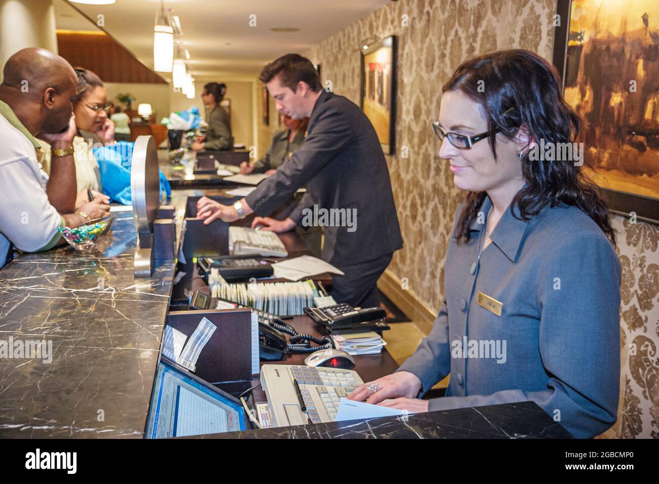 Canada Quebec Province Montreal,Boulevard Rene Levesque Fairmont Queen Elizabeth,hotel front desk,check in reception reservations registration woman f Stock Photo