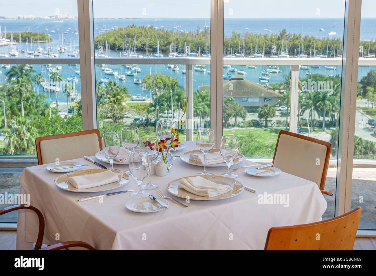 Miami Florida,Coconut Grove Sonesta hotel Panorama restaurant,Biscayne Bay water view dining table, Stock Photo