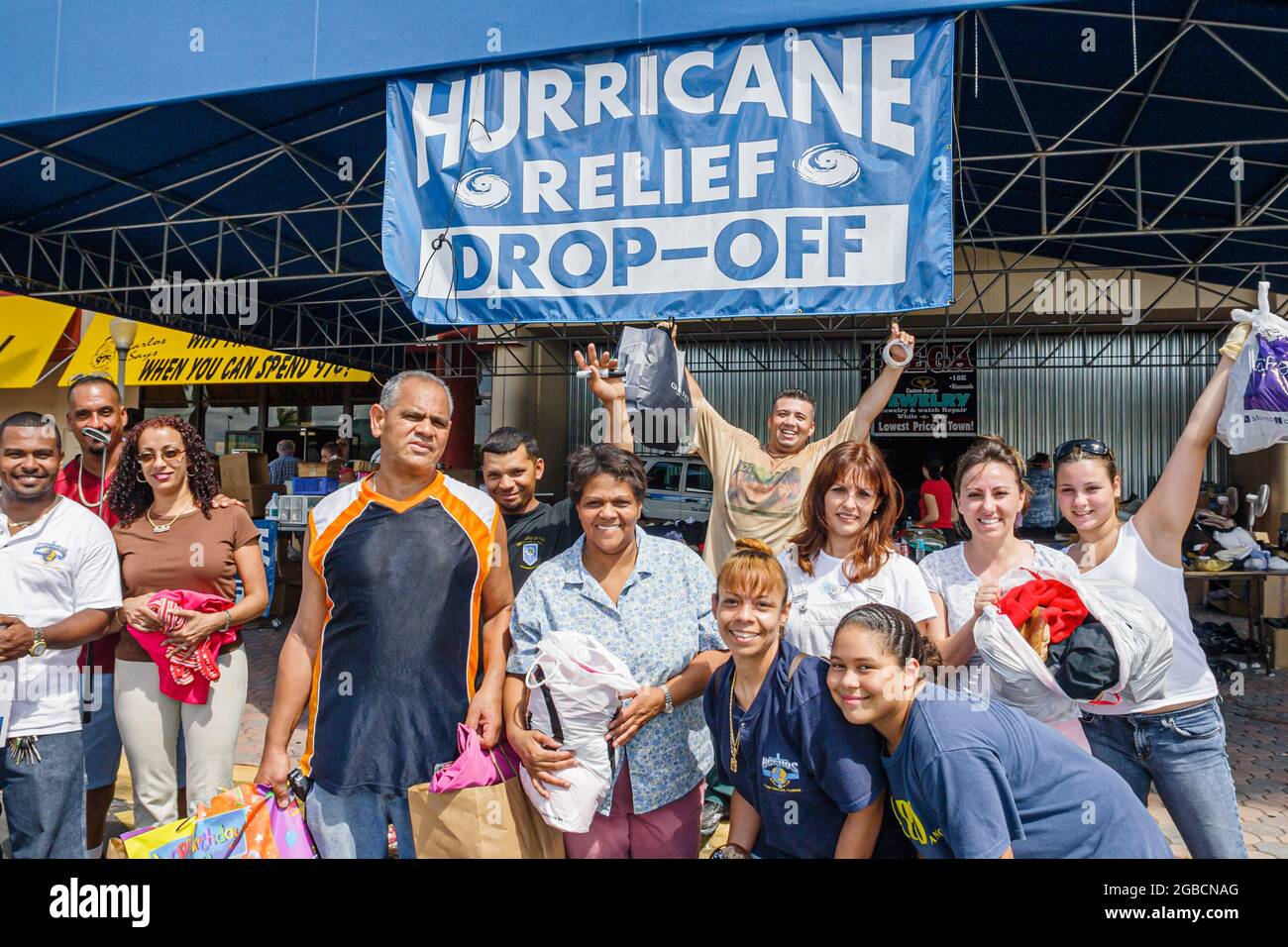 Florida Carol City Miami Hurricane Relief Drop Off banner volunteers,donations Black Hispanic men women students teens teenagers boys girls Stock Photo