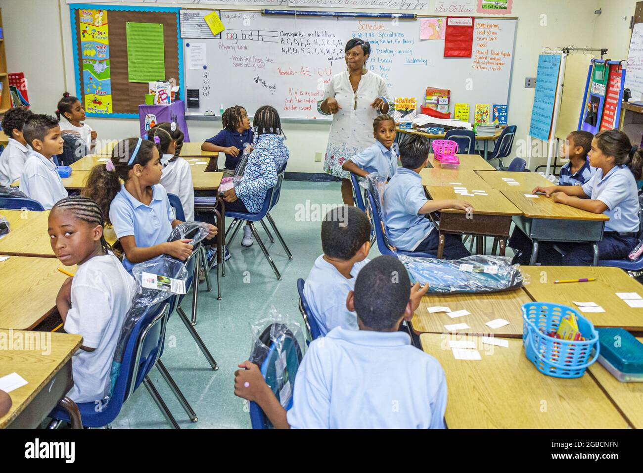 Miami Florida,Comstock Elementary School,Black boys girls kids children students,teacher teaching classroom grade school class tables, Stock Photo