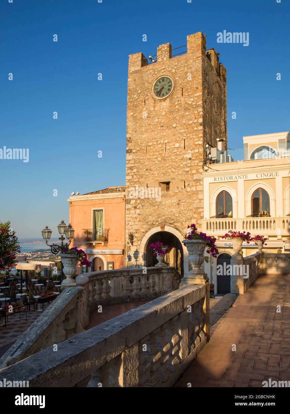 Taormina, Messina, Sicily, Italy. View from terrace of the Church of San  Giuseppe across Piazza IX Aprile to the Torre dell'Orologio, sunrise Stock  Photo - Alamy