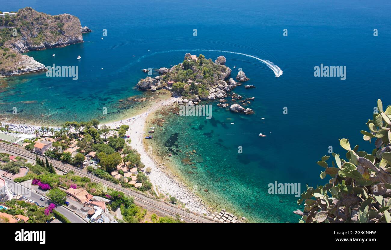 Taormina, Messina, Sicily, Italy. Spectacular clifftop view over the Ionian Sea off Mazzarò and the tiny island nature reserve of Isola Bella. Stock Photo