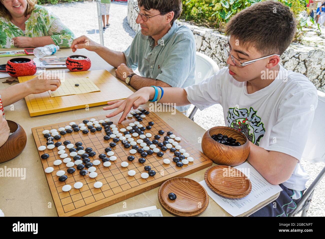 Miami Florida,MacArthur Causeway,Ichimura Japanese Garden Haru Matsuri Spring Festival,Go plays playing board game,Asian boy teen teens teenager teena Stock Photo