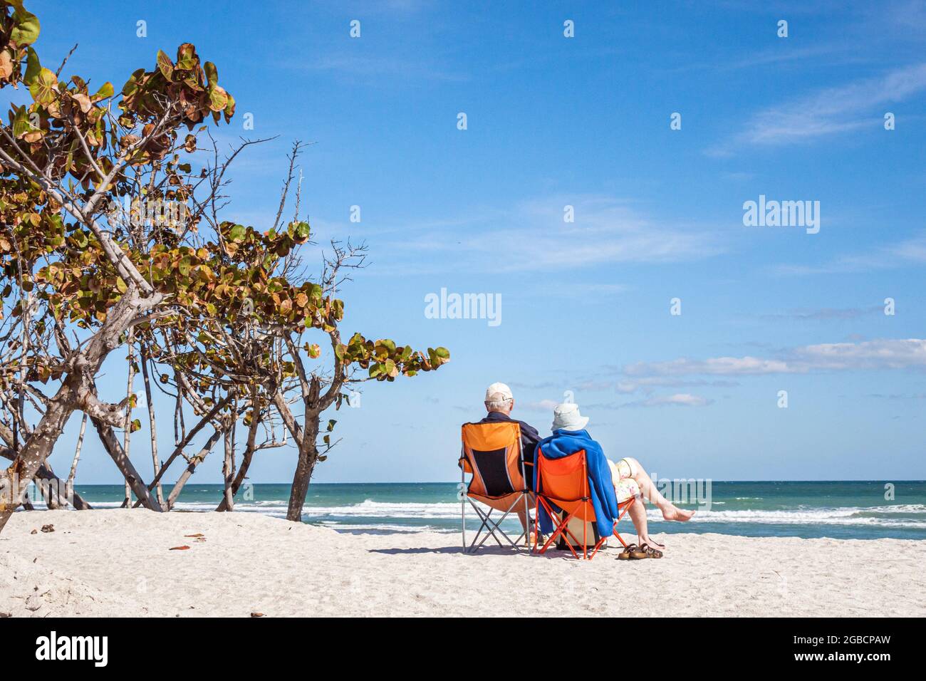 Stuart Florida,Hutchinson Barrier Island Bathtub Reef Beach senior seniors citizens,elderly couple sitting seated chairs sand dune Atlantic Ocean, Stock Photo