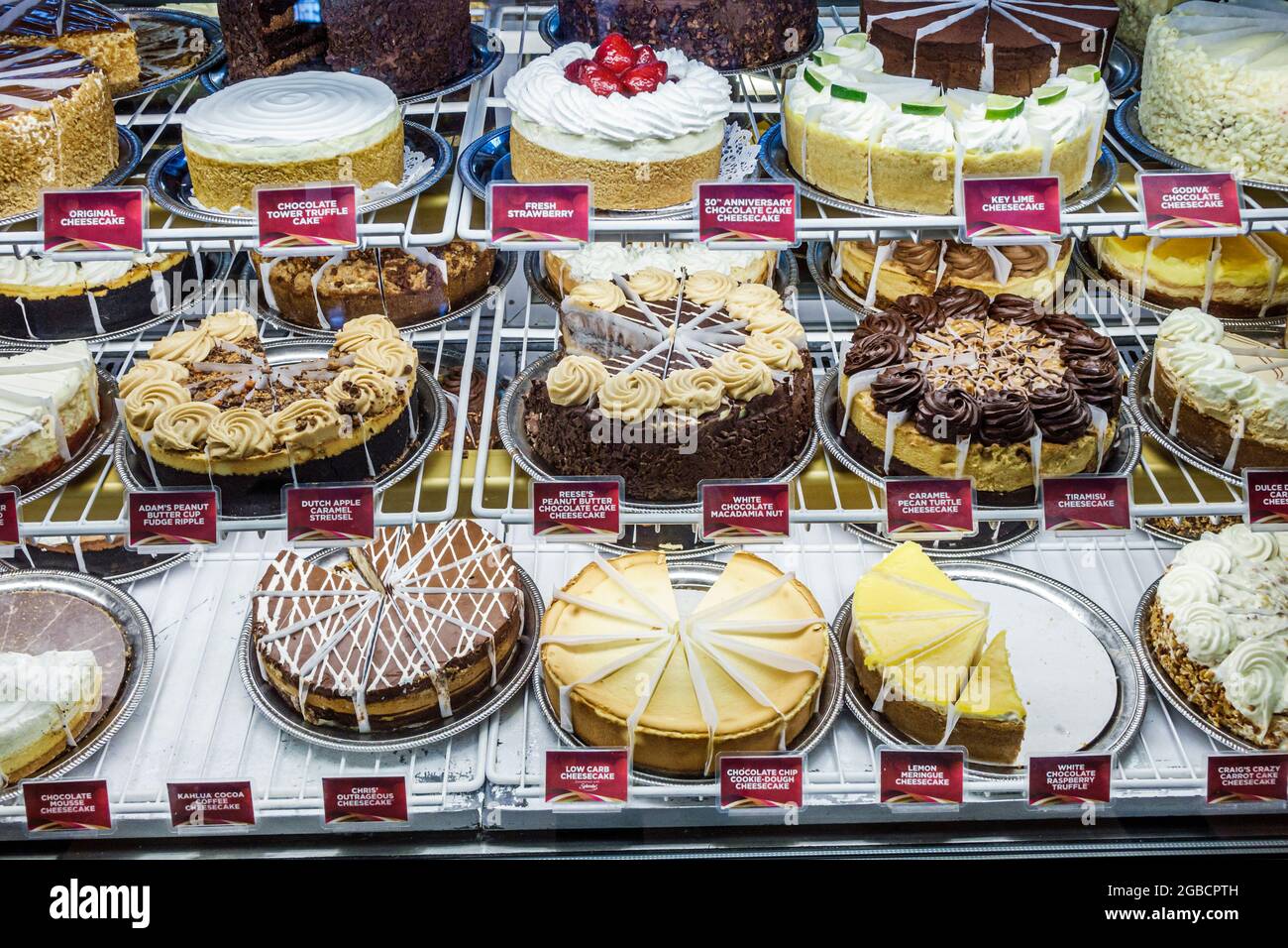 Florida Naples Coastland Center Shopping Mall,Cheesecake Factory restaurant display case cheesecake desserts chocolate sale, Stock Photo