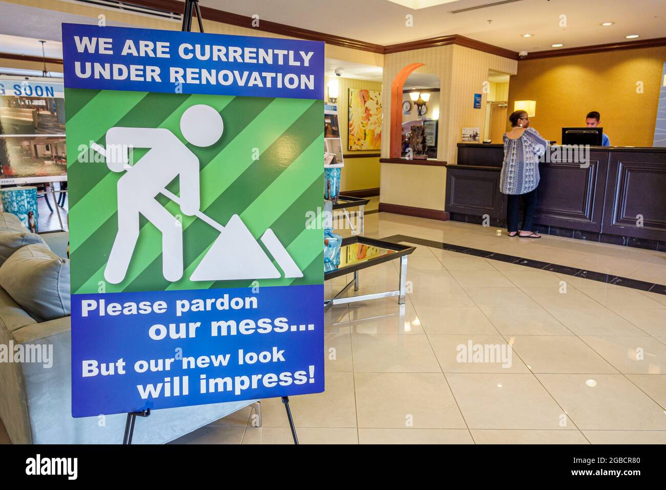Florida Clearwater,Holiday Inn Express hotel motel lobby,front desk check in reception reservation reservations register registration,sign under renov Stock Photo