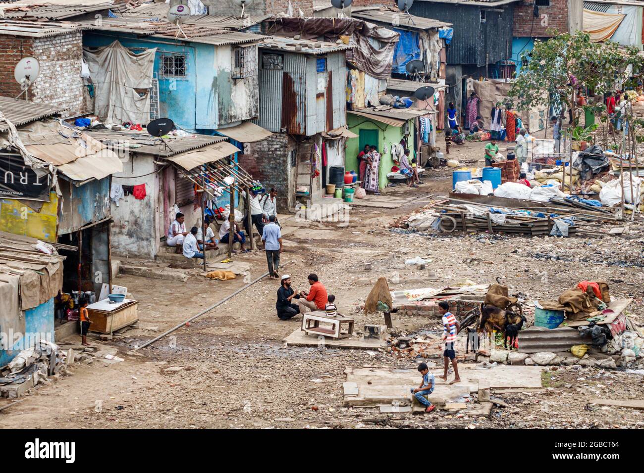 Mumbai India,Dharavi Shahu Nagar,slum poor poverty lower Hindu caste,residents low income trash litter urban ghetto homes Stock Photo