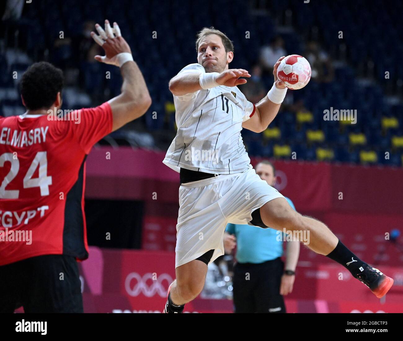 Tokyo. 3rd Aug, 2021. Steffen Weinhold (R) of Germany competes against Ibrahim Elmasry of Egypt during the handball men's quarterfinal between Germany and Egypt at Tokyo 2020 Olympic Games in Tokyo, Japan on Aug. 3, 2021. Credit: Guo Chen/Xinhua/Alamy Live News Stock Photo