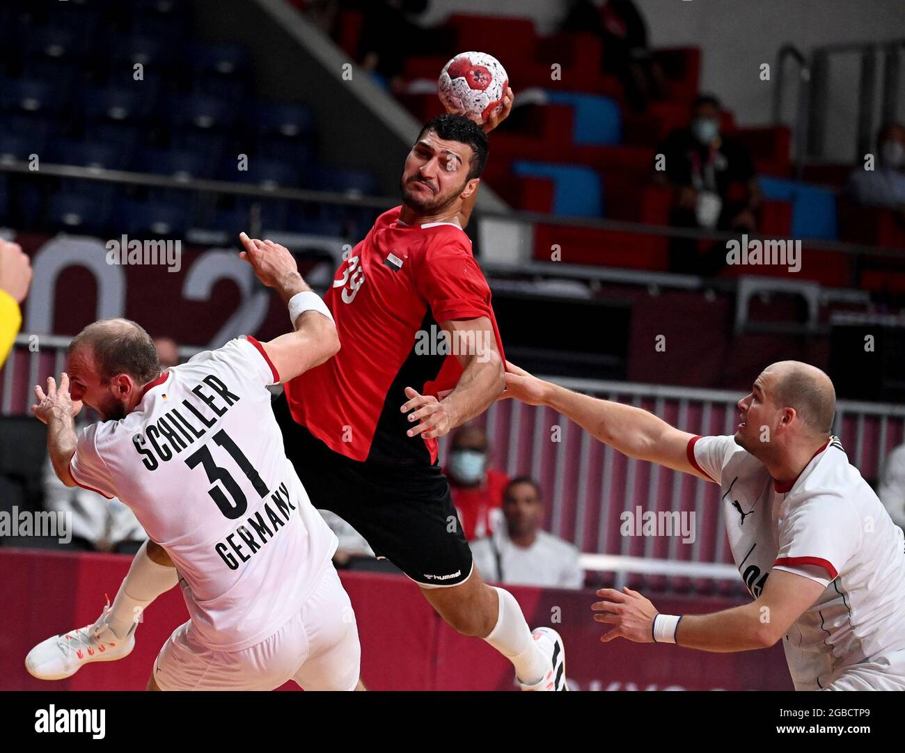 Tokyo. 3rd Aug, 2021. Yehia Elderaa (top) of Egypt competes during the handball men's quarterfinal between Germany and Egypt at Tokyo 2020 Olympic Games in Tokyo, Japan on Aug. 3, 2021. Credit: Guo Chen/Xinhua/Alamy Live News Stock Photo