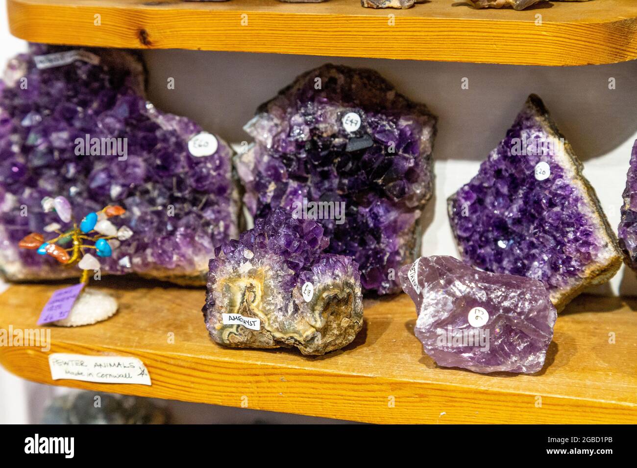 Display of amethyst crystals at Emjems crystal and gem shop, St Ives, Cornwall, UK Stock Photo