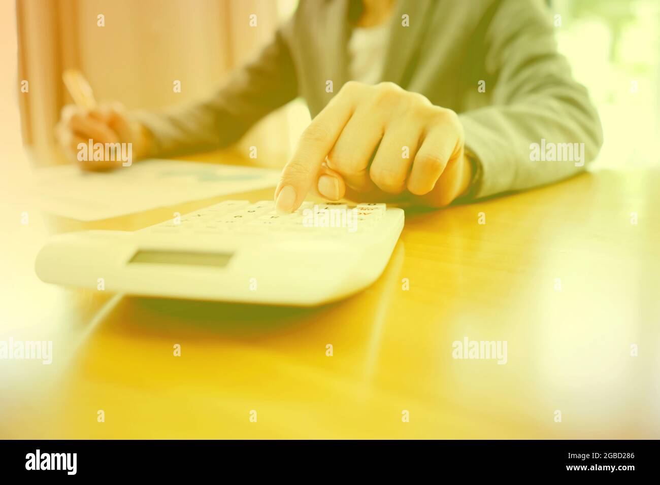 Businesswoman using calculator Stock Photo