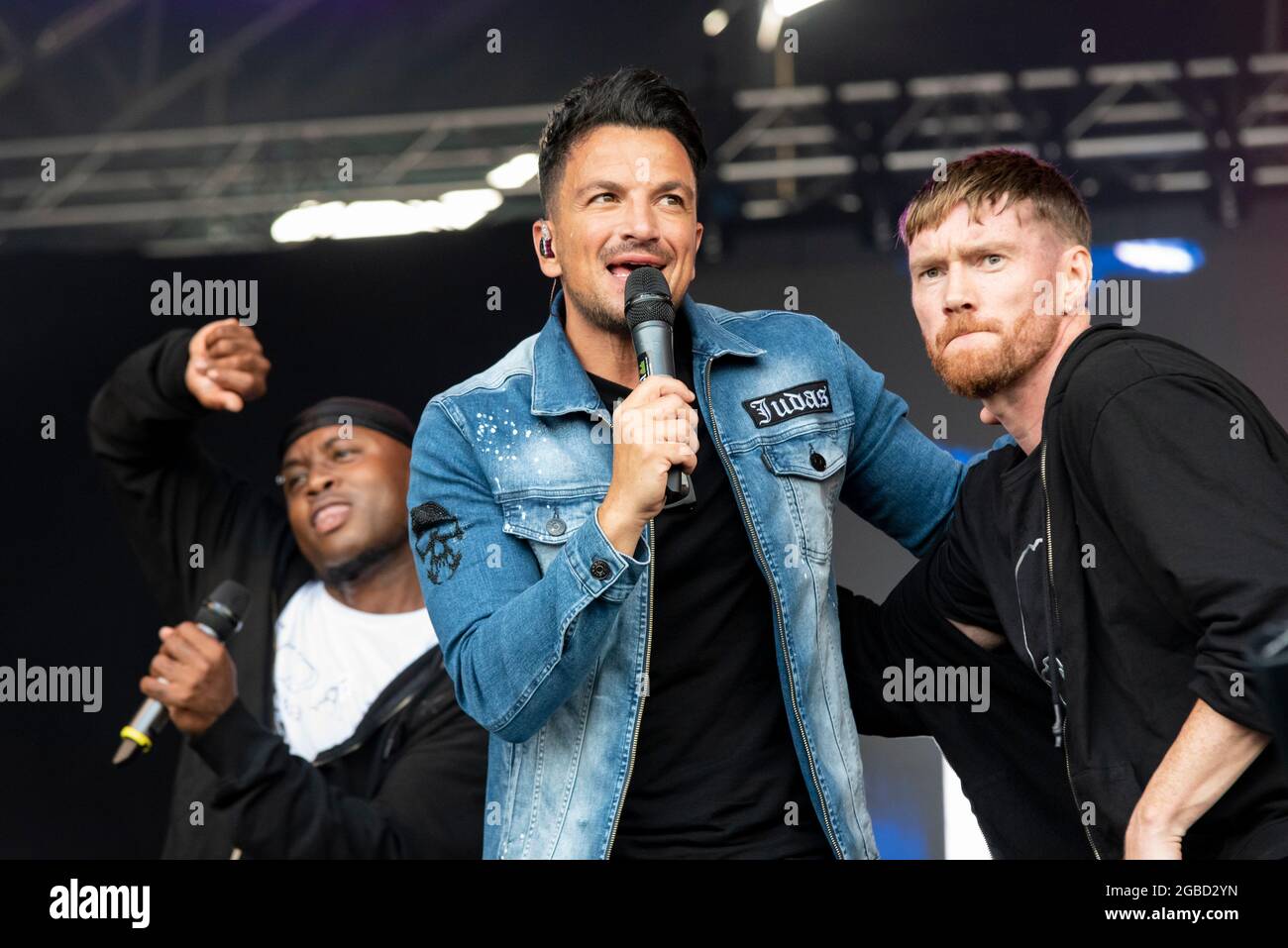 Peter Andre performing with backing singers on stage at the Fantasia music concert in Maldon, Essex, UK soon after lifting of COVID restrictions Stock Photo