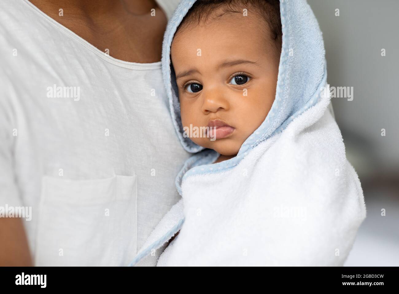 Portrait Of Cute Black Infant Child Wrapped In Blue Hooded Bath Towel Stock Photo Alamy