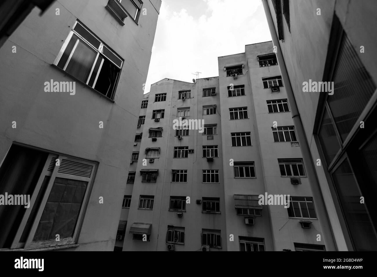 Grayscale shot of apartment buildings in the city Stock Photo