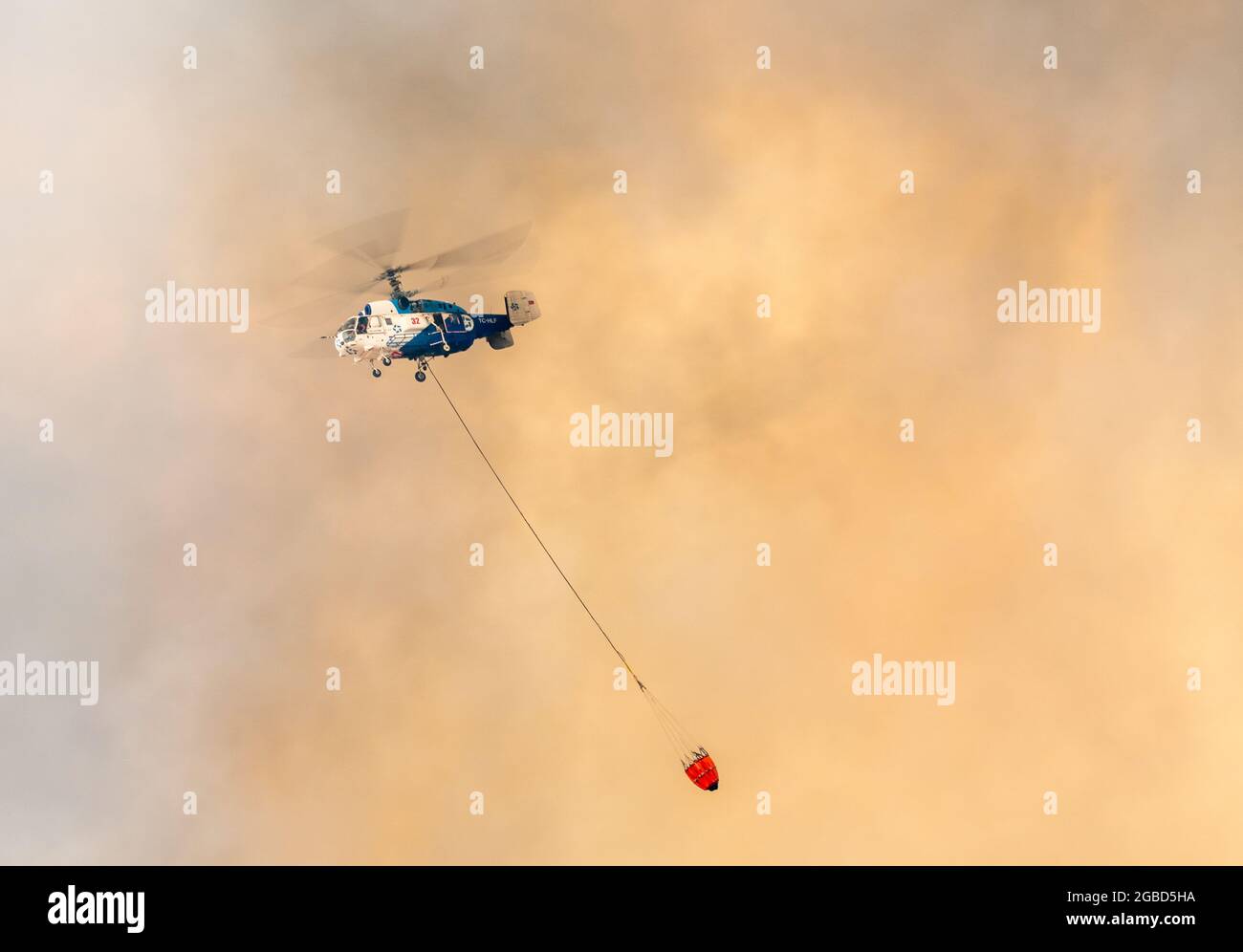 Marmaris, Mugla, Turkey – August 2, 2021. Kaumov Ka-32 fire-fighting helicopter during forest fires of July-August 2021 in Marmaris resort town of Turkey Stock Photo